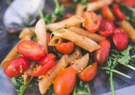 pasta dish with tomatoes and kale