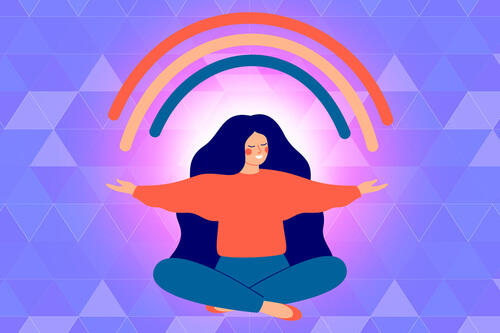 woman meditating with a rainbow above her